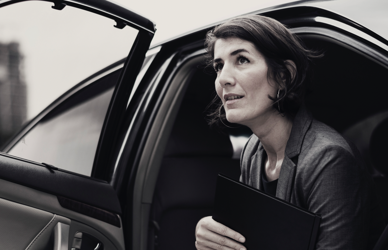 executive woman in car business