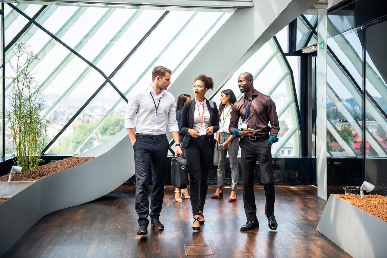 Business People Walking Through the Corridor