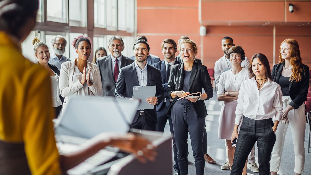 woman presents to a group of people