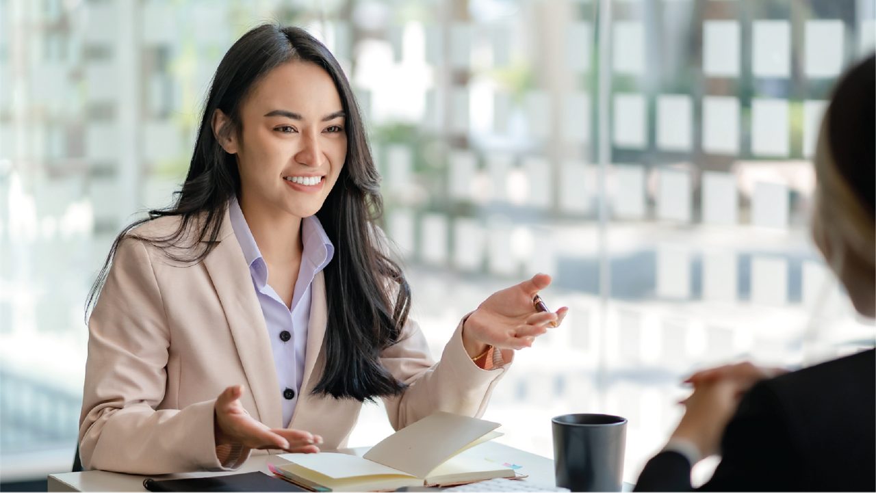 Professional talking in a meeting.