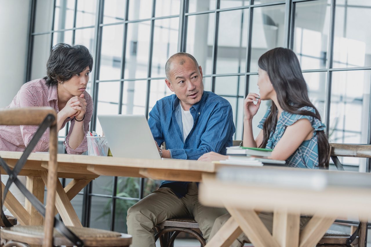 Three People Discussing