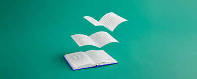 An open book soars over a lush green backdrop, representing the freedom of knowledge and exploration.