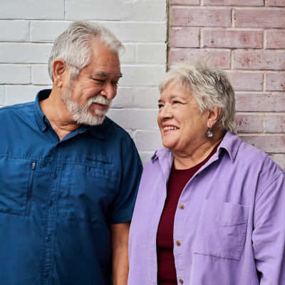 Older couple smiling at each other