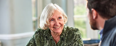 Older woman meeting with an estate settlement service provider