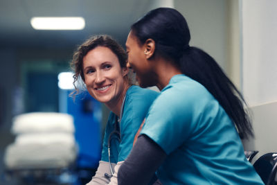 Two women discussing their first retirement contributions