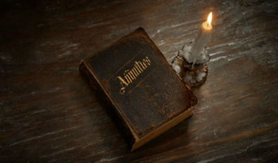 This old book of annuity myths is being illuminated by candlelight. It’s time to get rid of both.