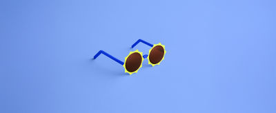 A pair of sunglasses with yellow rims
