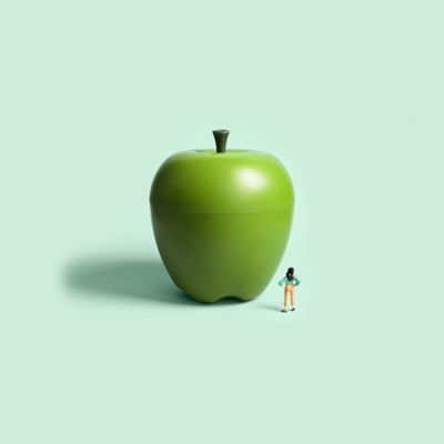 Woman looking at apple