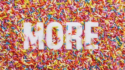 Bath of ice cream sprinkles with MORE letters peeking through