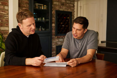 Men looking at rates