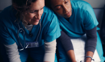 two medical employees siting beside each other