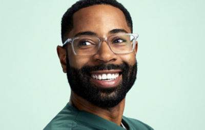 Man with glasses smiling