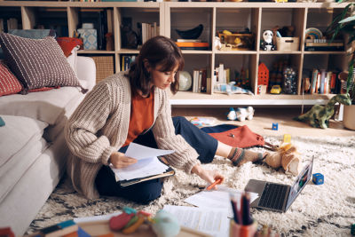 Woman reviewing documents about retirement account tax advantages