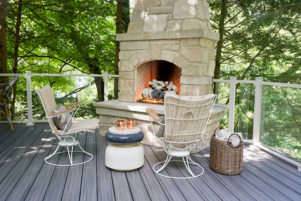 Outdoor space with stone fireplace