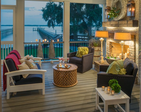 Screened in porch with decking in Trex Foggy Wharf with two Adirondack chairs looking out on the yard