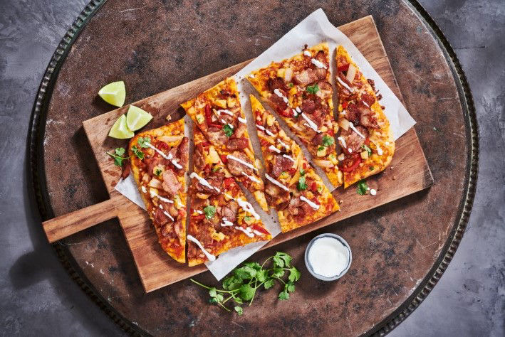 Ham bacon flatbread on a wooden plate image