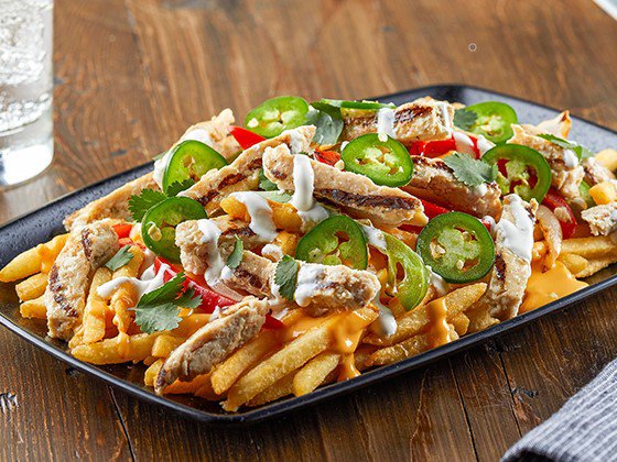 Chicken Fajita Loaded Fries featuring Tyson Red Label® Fajita Seasoned Chicken Breast Strips