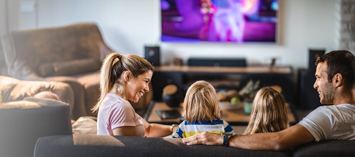 Family watching shows with satellite tv from DISH