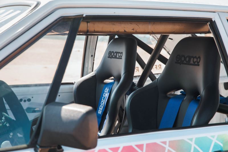 Inside look at Jason Whipple’s customized 1980 Volkswagen Scirocco through the driver’s side window.