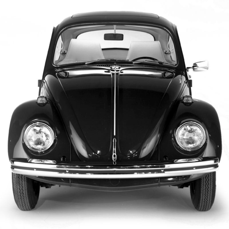 A black and white photo of historic Beetle, shown from the front.