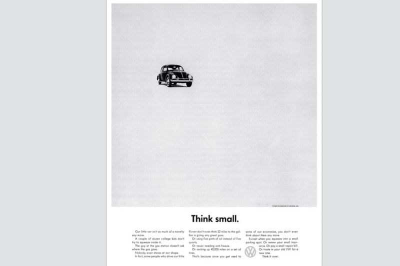 Iconic “Think Small” advertisement with mostly white space and a single, small Volkswagen Beetle.