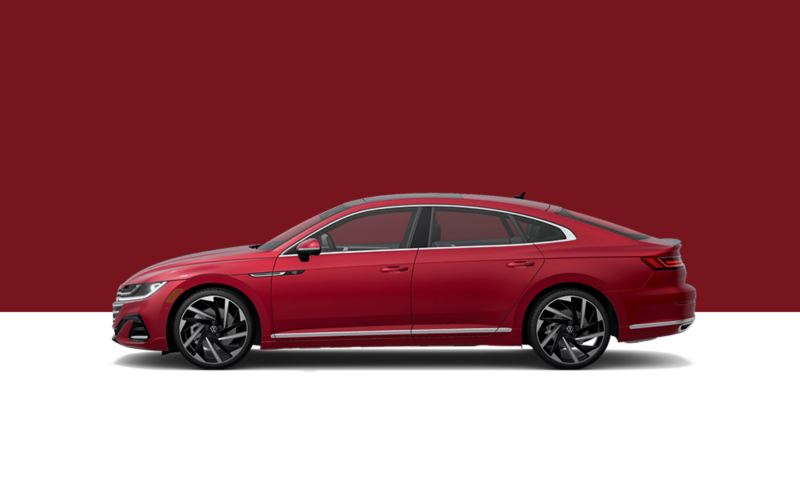 Driver’s side profile view of a Kings Red Metallic Arteon.