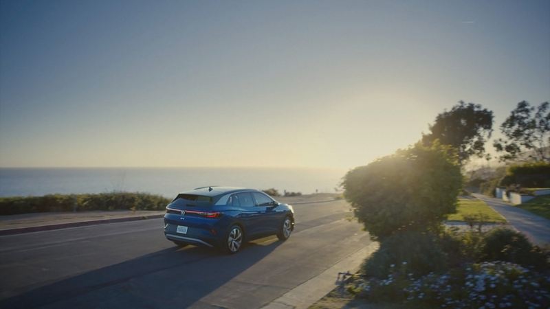 2021 Volkswagen ID.4 EV parked on an overlook by the ocean.