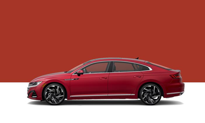A side profile view of a Volkswagen Arteon in Kings Red Metallic.