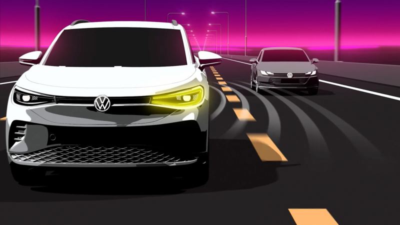 Graphic depicts a Volkswagen vehicle nearing a car in its blind spot.