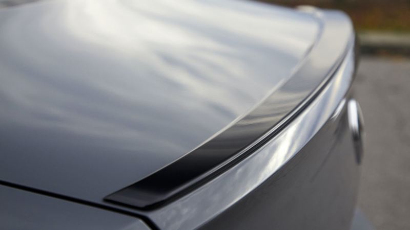 Closeup of rear spoiler of VW Jetta GLI in Pure Gray. Color adds an additional $395 to price of car.