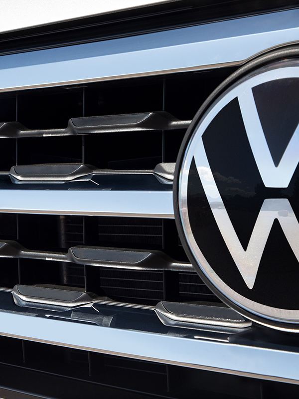 Close-up shot of the Atlas grille with VW logo and R-Line badging.