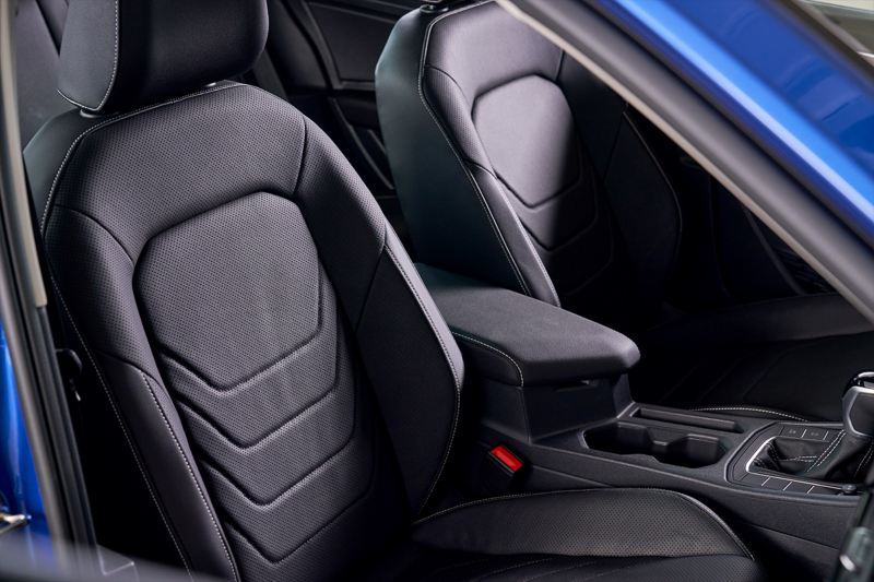 View of bolstered sport seats with leather seating surfaces as seen through the front passenger window.