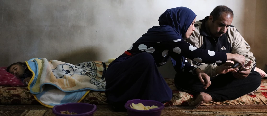 A Syrian family in their living room in Tripoli, Lebanon, where they had lived as refugees for the last 4 years. Photo © Dominic Chavez/World Bank