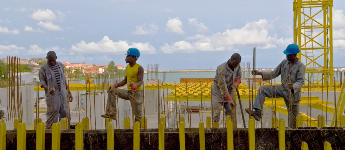 Construction workers on site. Photo: Arne Hoel / World Bank