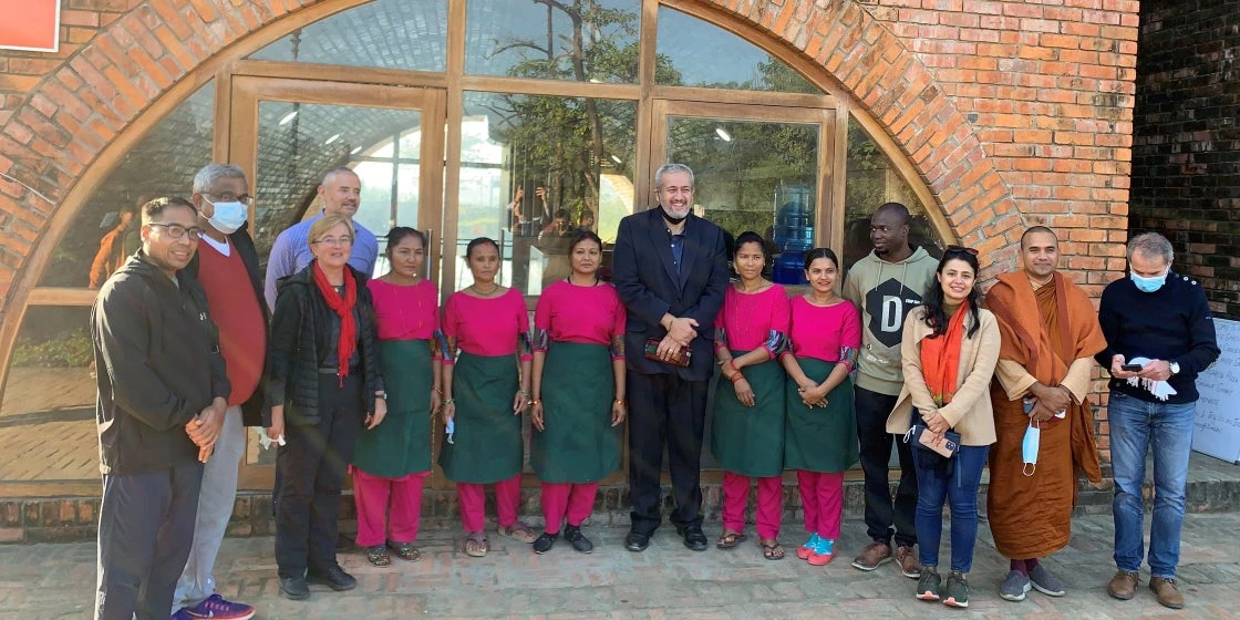 Faris Hadad-Zervos (centre) and the visiting representatives from various agencies with the team from Amma Café.  