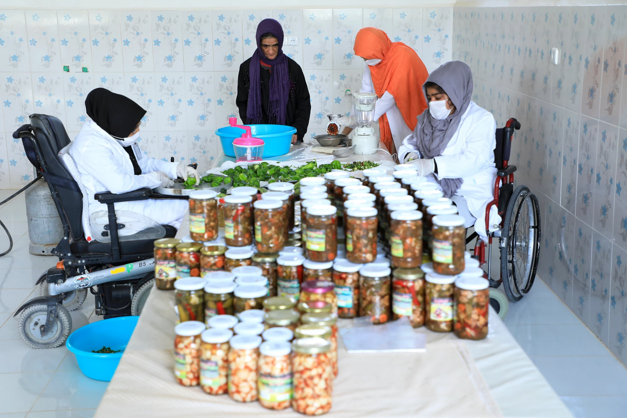 An Afghan woman working for small local business to support her family. Such business have been severely impacted by COVID-19 crisis. 