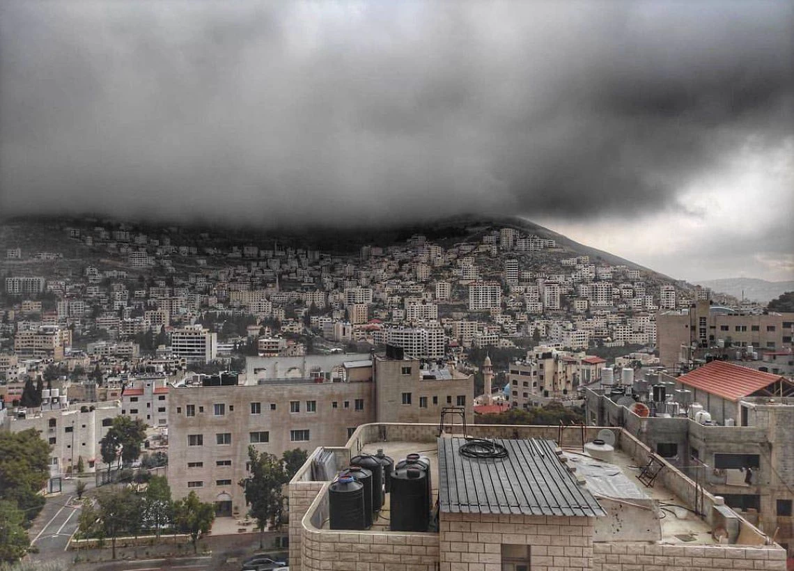 Clouds hover over the city of Nablus, Palestine.