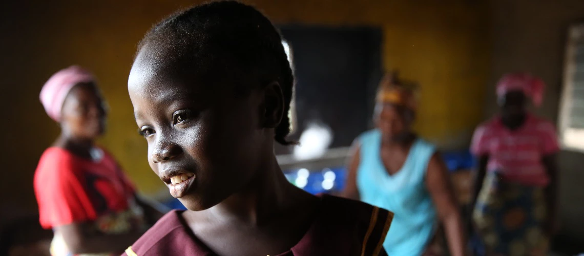 A portrait of Gift Sherman, 5 year old student at Hope Kindergarten Elementary School in Buchanan City, Liberia