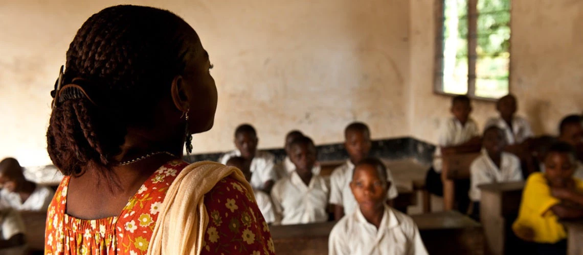 Teacher in front of students in a classroom