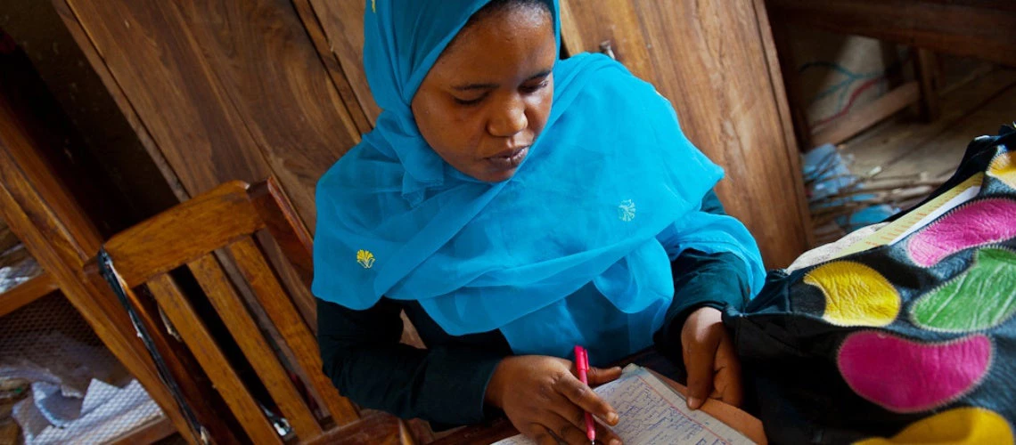 Woman writing in a notebook