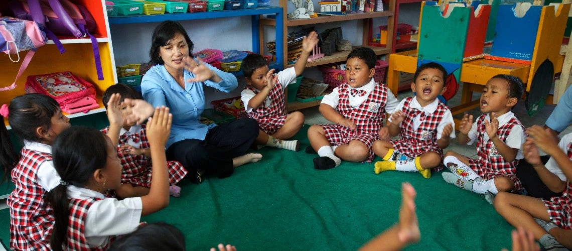 Teacher in front of children