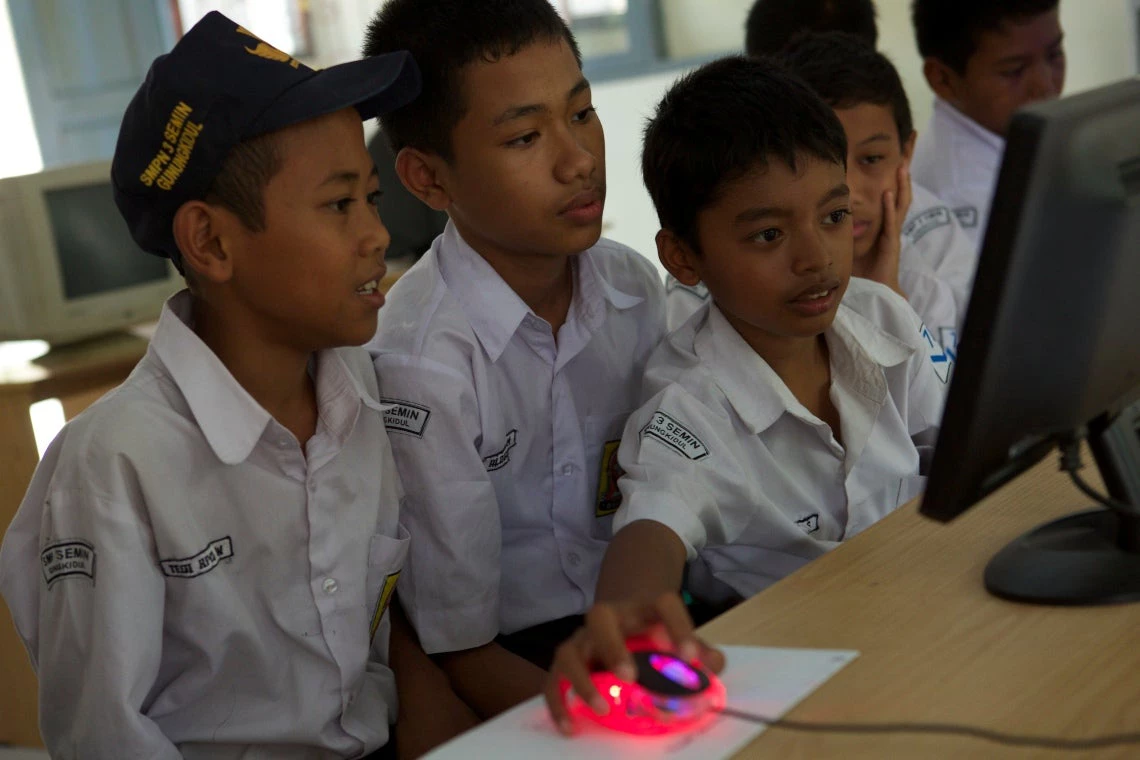 Schoolchildren using a computer