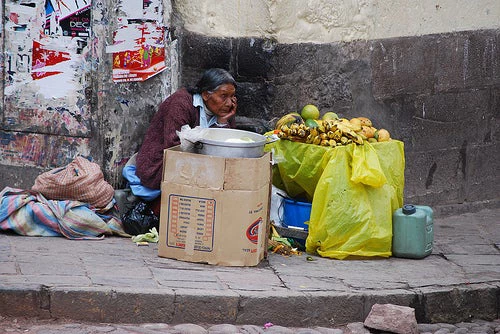 Selling fruit on the street in Cuzco, Peru. Photo credit: Flickr @eye1 