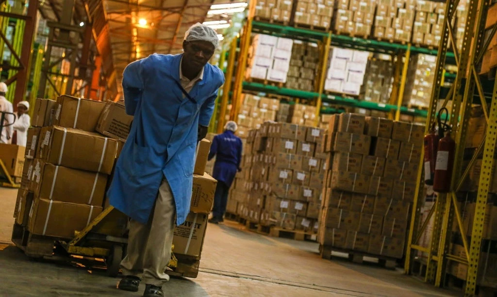 A worker transports medical supplies across a warehouse in Kenya. Photo: Sarah Farhat/World Bank