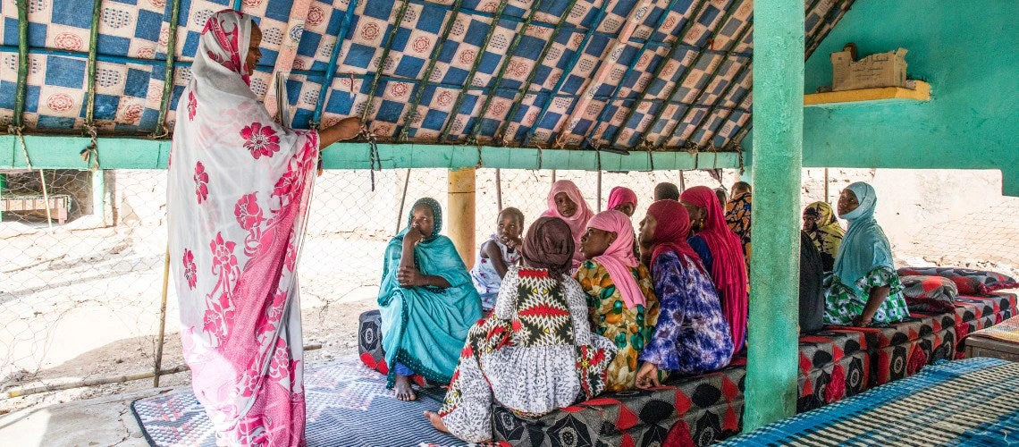 group of women meeting in a tent