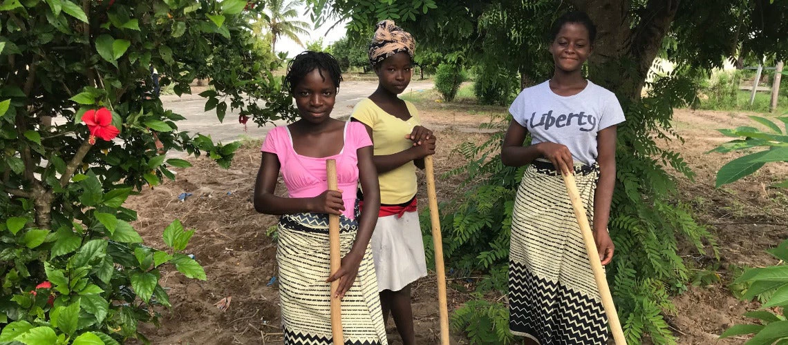 Maria, Amelia and Amelia working in the boarding school ?machamba,? an agricultural field. 