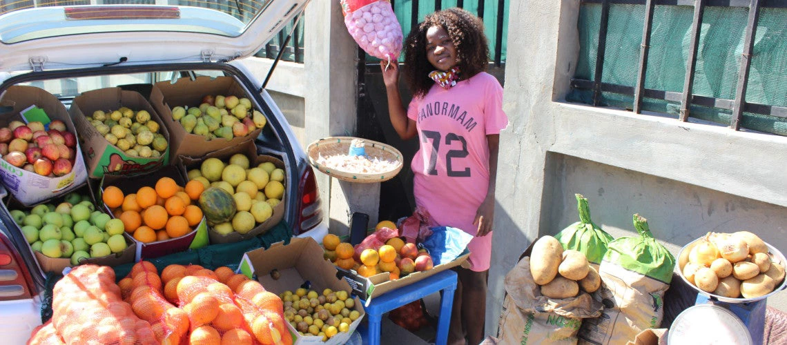 Selling processed food from her vehicle on the streets of downtown Maputo