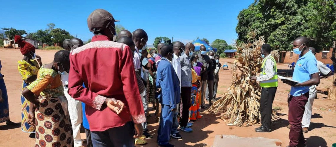 In the photo, Paul Mwale, an agronomist, talks with farmers at a harvest festival in Blantyre Lunzu EPA-Aquaid in Malawi on May 6, 2021.  Photo credit: Paul Mwale