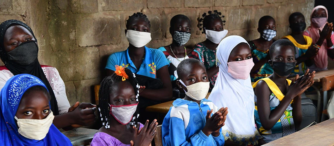 Children wear masks to protect themselves against COVID-19 while attending class in Fada, Burkina Faso. Photo: Frank Dejongh/UNICEF