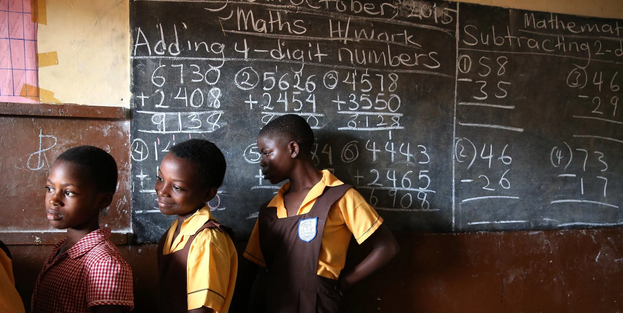 Students line up to wash their hands before eating at Kanda Estate Primary School in Accra, Ghana